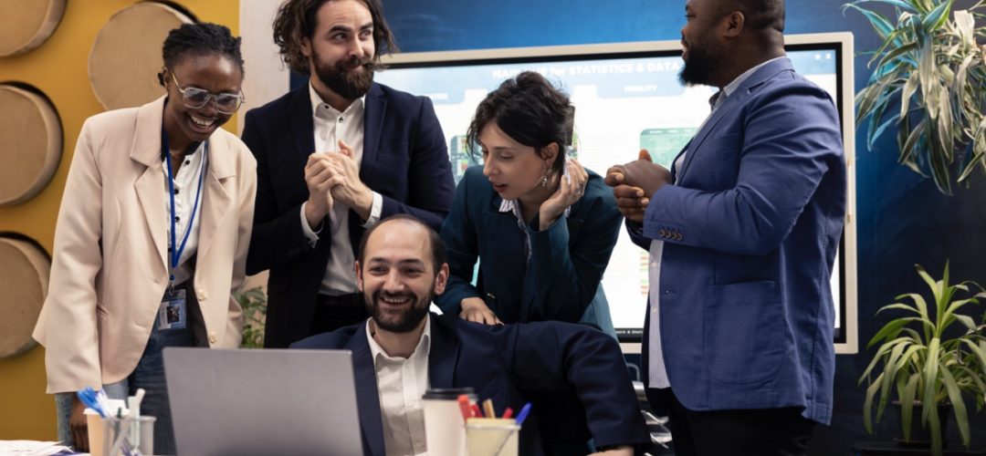 Finances team look at stock market trends and celebrating their victory in acquiring more capital for development. Satisfied cheerful workers and manager feeling proud about their team progress.